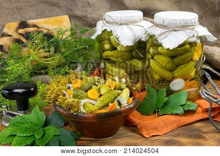 Pickled cucumbers, marinating in jars, cucumbers in a bowl, Cucumber pickle set