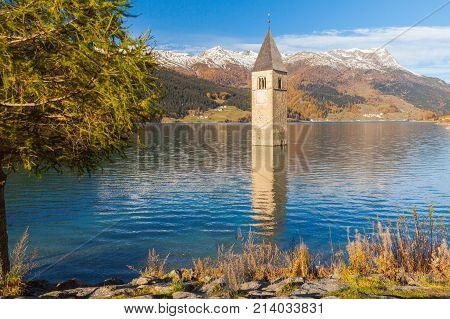 Submerged bell tower in lake resia Italian eastern alps