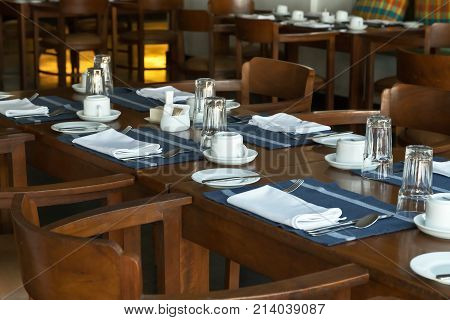 Glasses And Plates On Reserviert Table In Restaurant