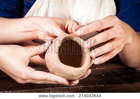 Close-up Of Women Potter  Working