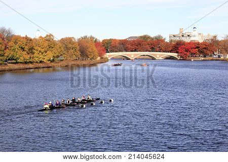 Boston City, Massachusetts - Nov 9, 2013: Athletes practising in their racing boat on Charles River in the downtown area of Boston City, on Nov 9, 2013.