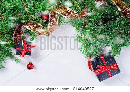 Black And Red  Christmas  Gift  Box With Red Ribbon And Fir Branches