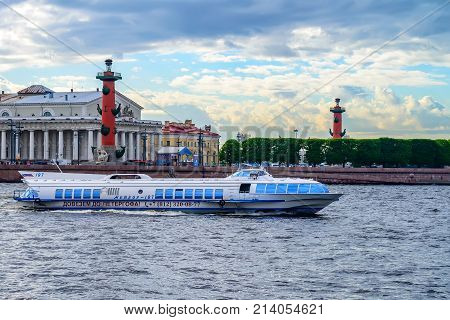 ST PETERSBURG, RUSSIA - CIRCA JUNE 2015: Meteor hydrofoil boat on water with Rostral Columns in background
