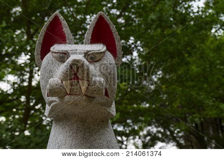 Nara, Japan - May 31, 2017: Close up of Kitsune, animal guardian in front of a Inari Shrine in Nara park