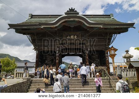 Nagano - Japan, June 3, 2017:  Niomon Gate, guarded by a pair of Nio Guardians, is the entrance to the important Buddhist Kenzoji temple 