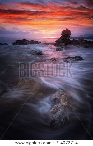 Seascape at sunset taken with long exposure to make slow movement of wave