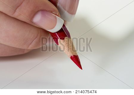 hand with red pencil