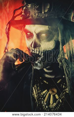 Baron Saturday. Baron Samedi. A man with a skull makeup dressed in a tail-coat and a top-hat. Dia de los muertos. Day of The Dead. Halloween.