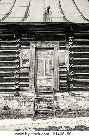 Folk architecture in Zdiar village Belianske Tatry mountains Slovak republic. Painted house. Travel destination. Black and white photo.