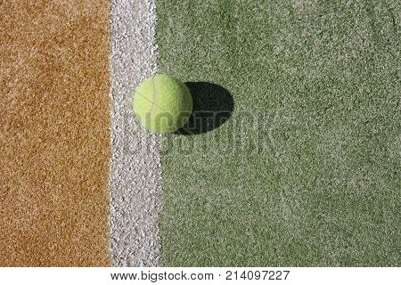 Tennis baal on a white line. Waiting for the next game