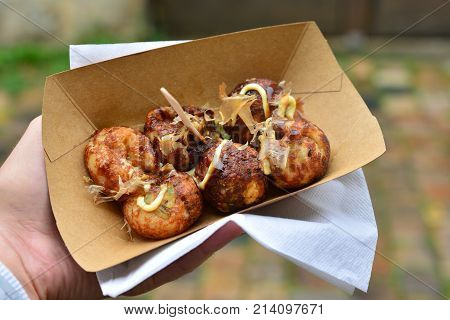 fried Japanese balls of fish tofu and squid in a box