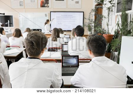 High school student in the classroom. Education team
