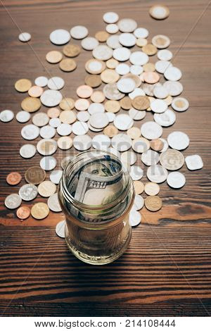 Glass Jar With Banknotes And Coins