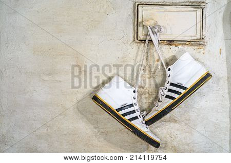 White Adidas Sneakers Hang On Laces