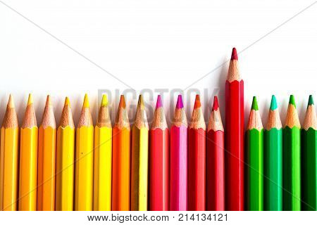 Leadership Concept With One Pencil Standing Out Of Crowd Of Other Pencils