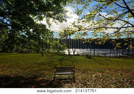 Wooden bench looking out int the waters