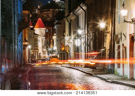 Tallinn, Estonia. Traffic Lights Trails In Night Street Near Famous Landmark Viru Gate In Street Lighting At Evening Illumination. Christmas, Xmas, New Year Holiday Vacation In Old Town. Popular Touristic Place.