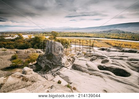 Uplistsikhe, Shida Kartli Region, Georgia. Remnants Of Altar In Famous Landmark Uplistsikhe Is An Ancient Rock-hewn Town In Eastern Georgia. Landscape In Sunny Autumn Day. UNESCO  World Heritage Site.