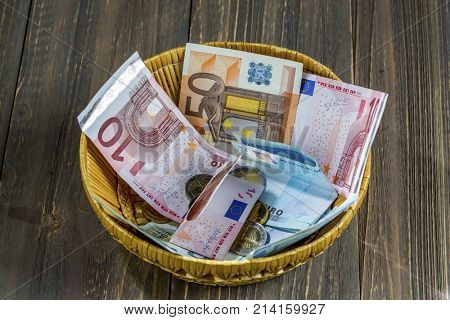 basket of money from donations