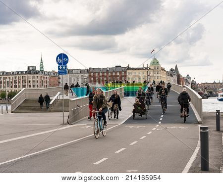 COPENHAGEN, DENMARK - SEPTEMBER 18: Pedestrians on Inderhavnsbroen on September 18, 2017 in Copenhagen. The bridge was opened in 2016.
