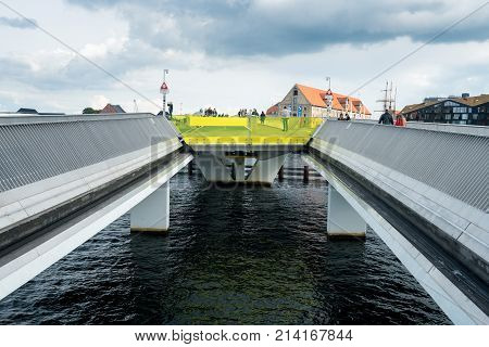 COPENHAGEN, DENMARK - SEPTEMBER 18: Pedestrians on Inderhavnsbroen on September 18, 2017 in Copenhagen. The bridge was opened in 2016.
