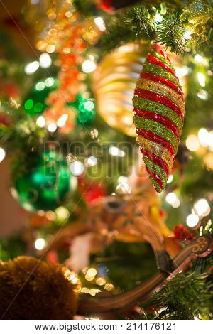 Multi-colored And Glitter Christmas Ornament Hang On Tree In Selective Focus