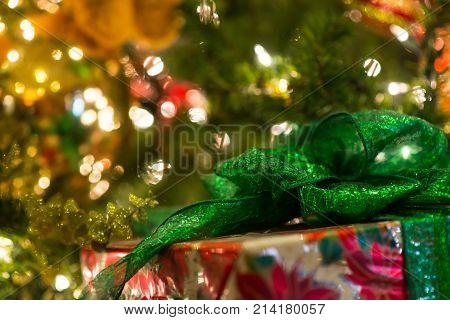 Christmas Background. Green Ribbon Of The Gift Box In Focus At The Corner