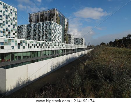 The Hague Netherlands - November 3 2017: The new 2016 opened International Criminal Court building with moat located between dunes in The Hague.