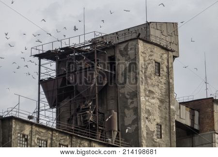 Old brick elevator. Old city. Fragment of the old building