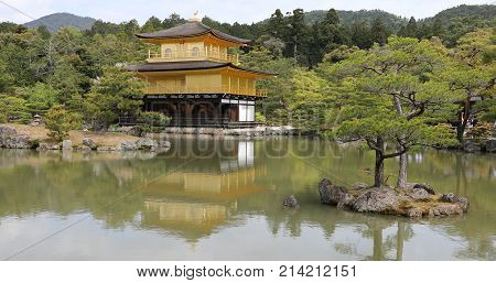 Kinkaku-ji, Golden Pavilion, famous buddhist temple zen of Rinzai sect in Kyoto reflected in the lake. The Rokuonji is one of most visited Kyoto temples. Concept of Buddhism and meditation.