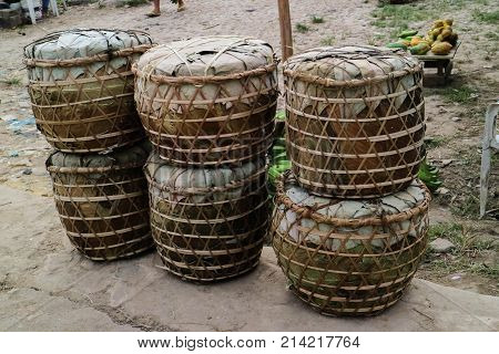 Brazilian handmade indian bucket with fruits in the port