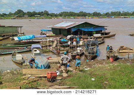 Wooden Canoe In River Port