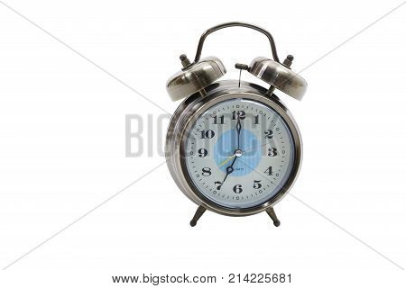 Traditional wind-up (keywound) mechanical spring-driven alarm clock isolated on white background