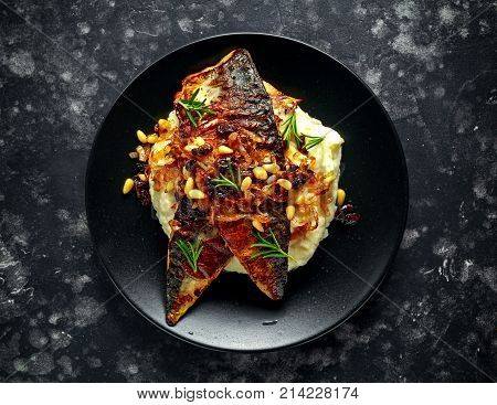 Sicilian style mackerel on cauliflower puree with caramelized onions, pine nuts.