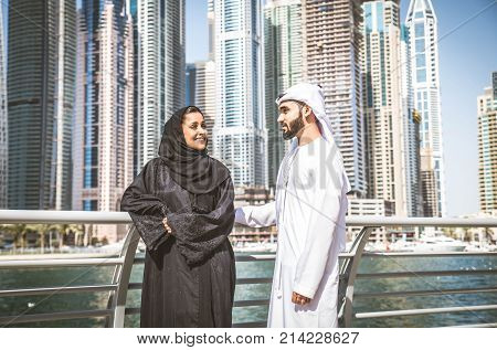 Arabic couple with traditional clothes dating outdoors