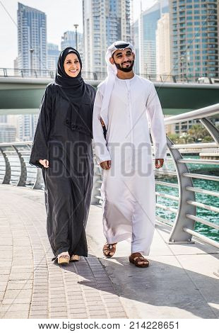 Arabic couple with traditional clothes dating outdoors
