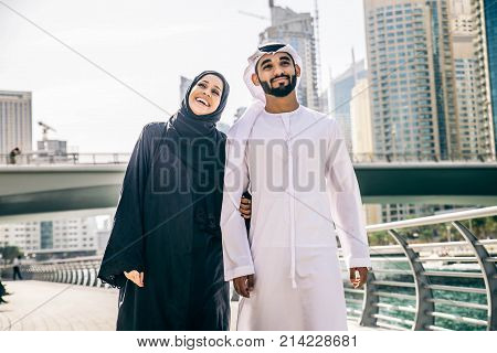 Arabic couple with traditional clothes dating outdoors