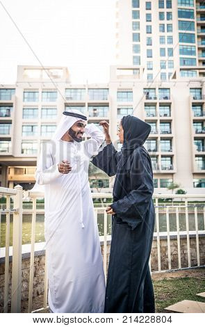 Arabic couple with traditional clothes dating outdoors