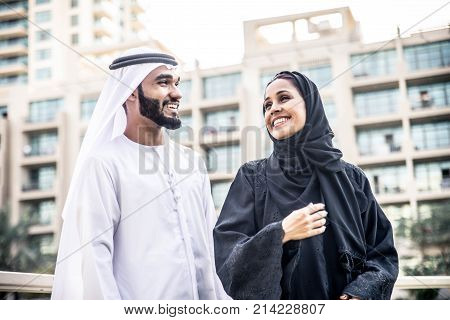 Arabic couple with traditional clothes dating outdoors