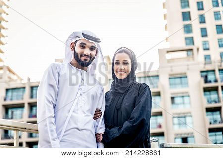 Arabic couple with traditional clothes dating outdoors
