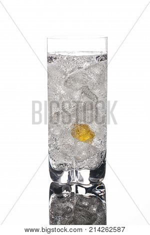 Crystals of ice in a glass with water on a glass background