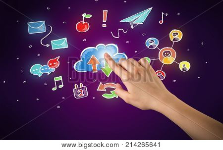 Female hand toucing mixed media icons with purple background