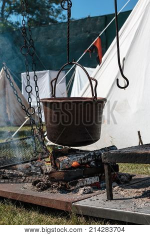 Black Cauldron on Bonfire in Outdoor Camping.