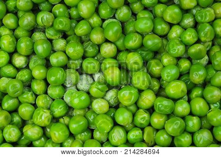 Frozen pea peases texture background. Green pease background pattern. Green peas.