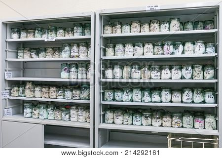 MOSCOW RUSSIA - June 24 2009. Glass jars with rags inside - samples of human's sweat and blood. Shelves with material evidences in laboratory of examination human olfactory traces.