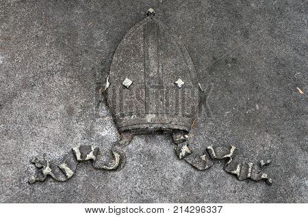 THUNDERBOLT, GA - October 8, 2017 A pontiff hat on the top of a memorial vault at Bonaventure Cemetery.