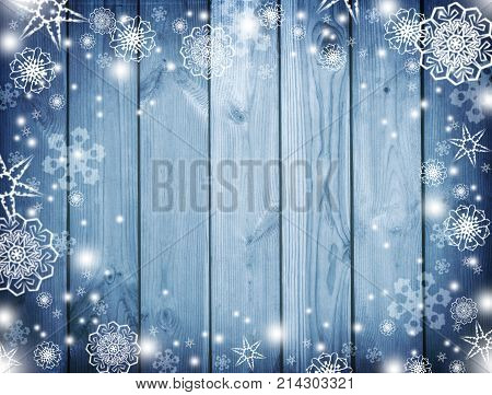 Blue christmas background.   New Year Frame for your text. Winter. Snowy Plank With Wintry  Background. blue wooden snowy background.top view.Christmas night and snowfall.
