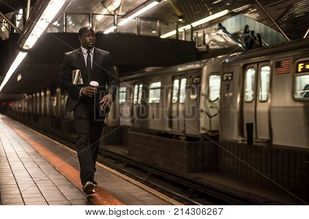 Businessman in full suit in New York subway metro
