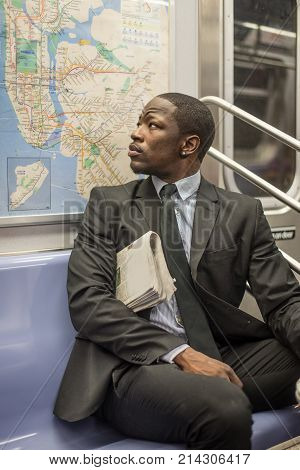Businessman in full suit in New York subway metro