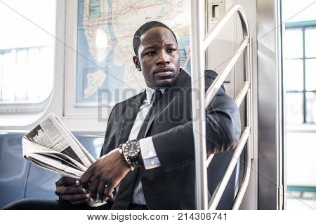 Businessman in full suit in New York subway metro